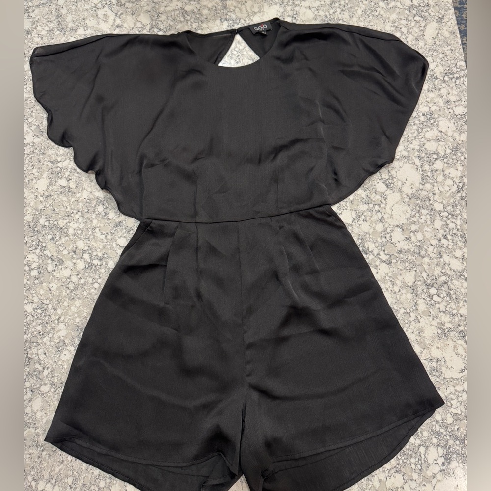 Chic Black Romper with Flutter Sleeves, Defined Waist, Open Back and Pockets
